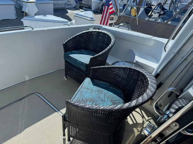 Slide: The Image of Two wicker chairs on the deck of a 2001 Carver 450 Voyager Pilothouse yacht. - 9
