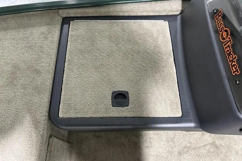 Slide: The Image of 2026 Tracker Bass Tracker® Classic Limited boat interior with carpeted storage compartment. - 14