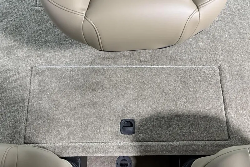 Slide: The Image of 2026 Tracker Bass Tracker® Classic Limited boat interior with beige carpet and seat. - 15