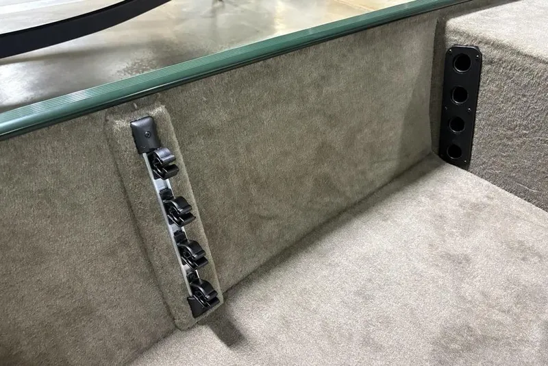 Slide: The Image of 2026 Tracker Bass Tracker® Classic Limited interior with rod holders and carpeted finish. - 16