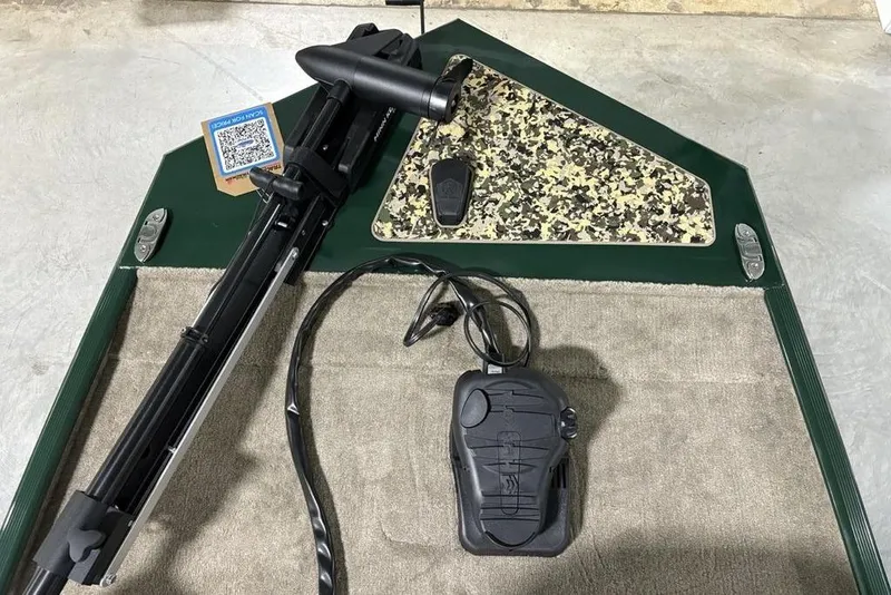 Slide: The Image of 2026 Tracker Bass Tracker® Classic Limited boat deck with trolling motor and camo panel. - 8