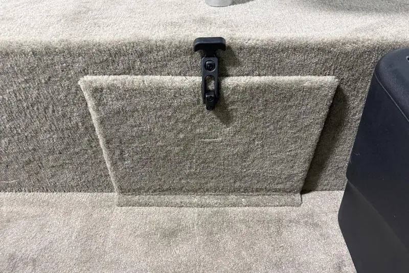 Slide: The Image of 2026 Tracker Bass Tracker® Classic Limited carpeted storage compartment with latch. - 9