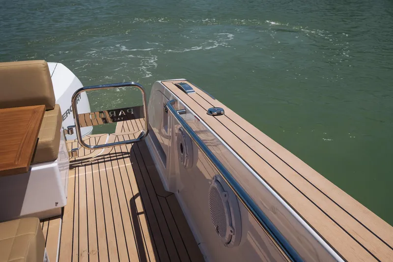 Slide: The Image of 2025 Pardo Yachts 38 deck with teak flooring and water view. - 32