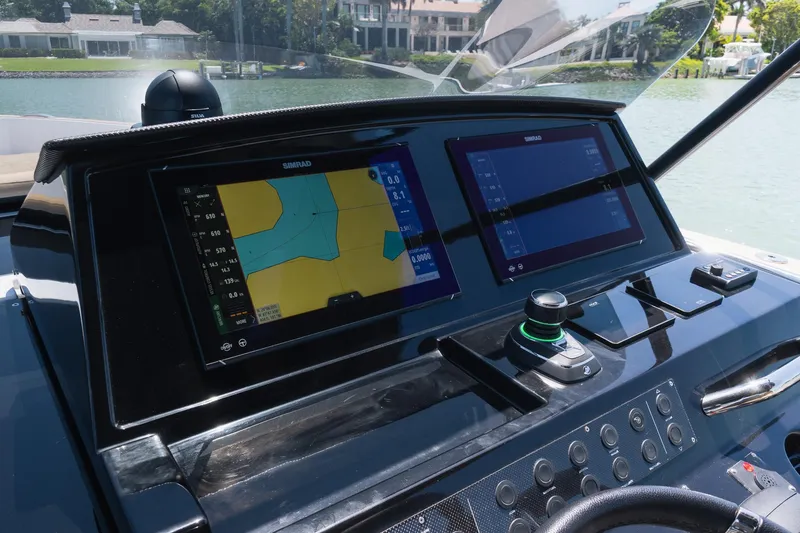 Slide: The Image of Helm of 2025 Pardo Yachts 38 with dual Simrad displays and joystick control. - 34