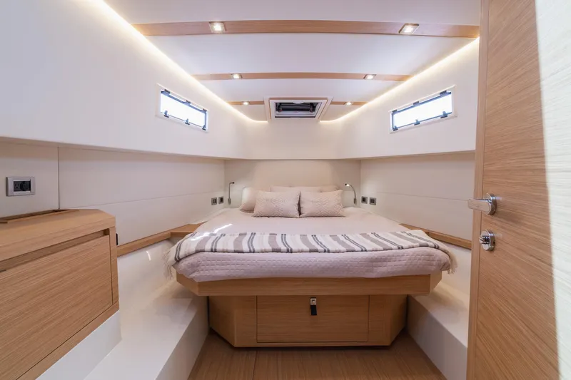 Slide: The Image of Luxurious cabin interior of 2025 Pardo Yachts 38, featuring modern design and cozy bedding. - 37