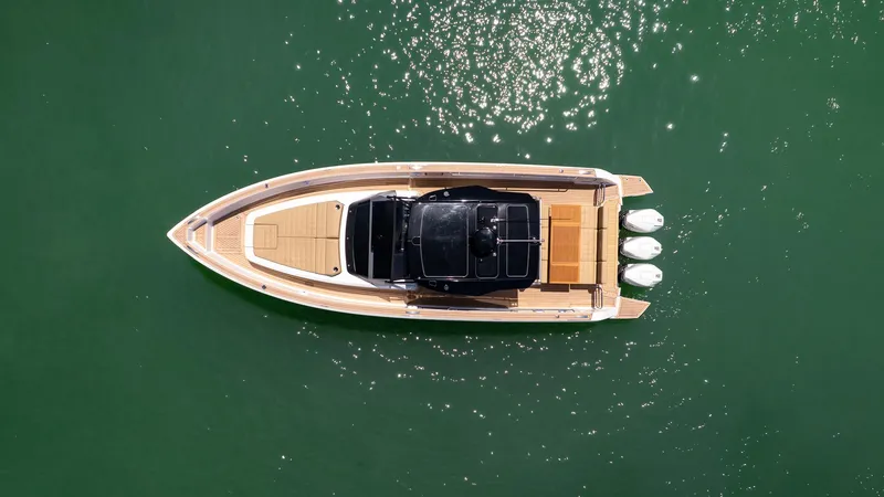 Slide: The Image of Aerial view of 2025 Pardo Yachts 38 on shimmering green water. - 4