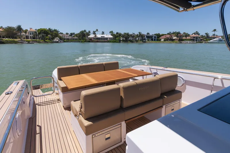 Slide: The Image of Luxury Pardo Yachts 38, 2025 model, cruising on a serene waterway with elegant seating. - 14