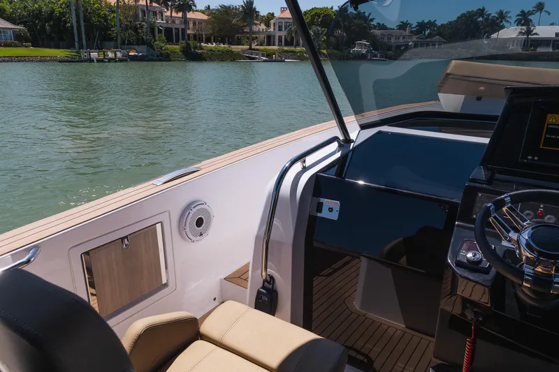Slide: The Image of 2025 Pardo Yachts 38 cockpit with luxurious seating and modern steering console. - 25
