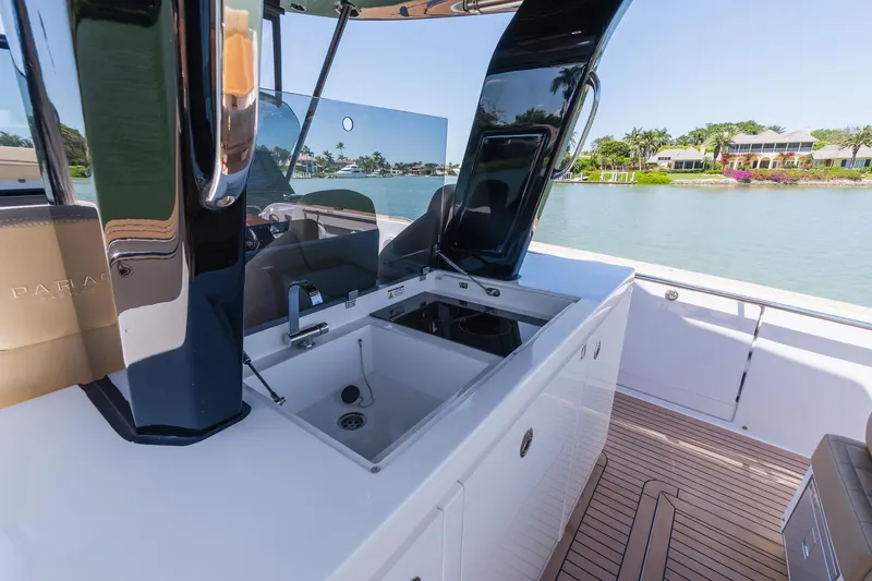 Slide: The Image of 2025 Pardo Yachts 38 with sleek outdoor kitchen and scenic waterfront view. - 26