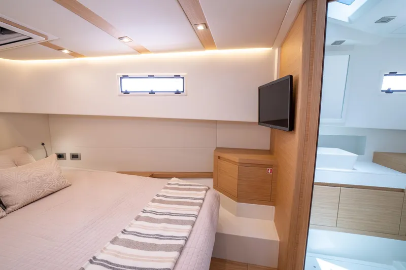 Slide: The Image of Luxurious interior of 2025 Pardo Yachts 38, featuring modern design and cozy bedding. - 38