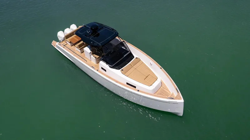 Slide: The Image of 2025 Pardo Yachts 38 luxury yacht on calm green water. - 6