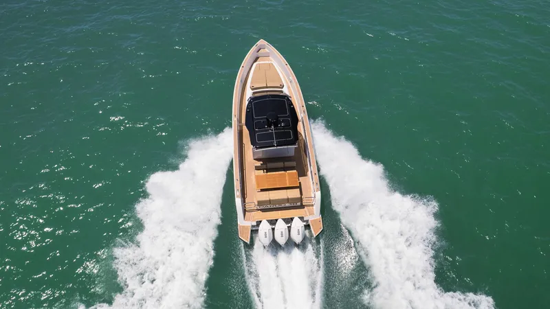 Slide: The Image of 2025 Pardo Yachts 38 cruising on open water, aerial view. - 9