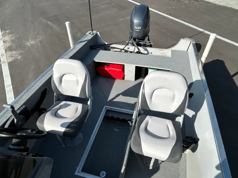 Slide: The Image of 2020 Smoker Craft Angler 16 XL SC dashboard with steering wheel and gauges. - 10