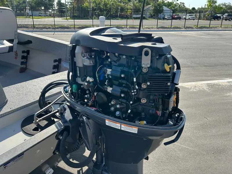 Slide: The Image of 2020 Smoker Craft Angler 16 XL SC boat storage compartments with gray carpeted interior. - 12