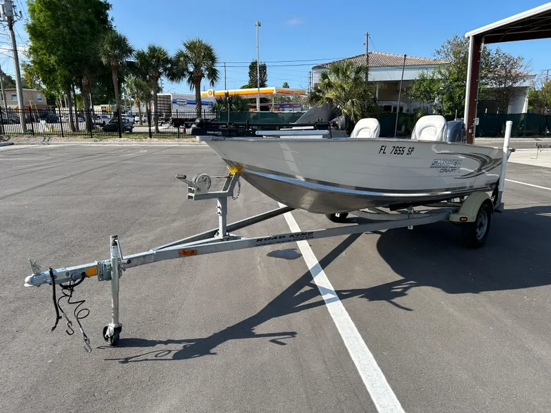 Slide: The Image of 2020 Smoker Craft Angler 16 XL SC boat on trailer with canopy in parking lot. - 5
