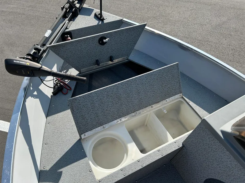 Slide: The Image of 2020 Smoker Craft Angler 16 XL SC boat deck with trolling motor and storage compartments. - 8