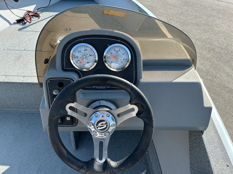 Slide: The Image of 2020 Smoker Craft Angler 16 XL SC boat interior with two seats and a Yamaha outboard motor. - 9