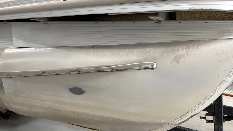 Slide: The Image of Close-up of a Bennington 20SSRCX pontoon with aluminum hull and weld seams. - 29