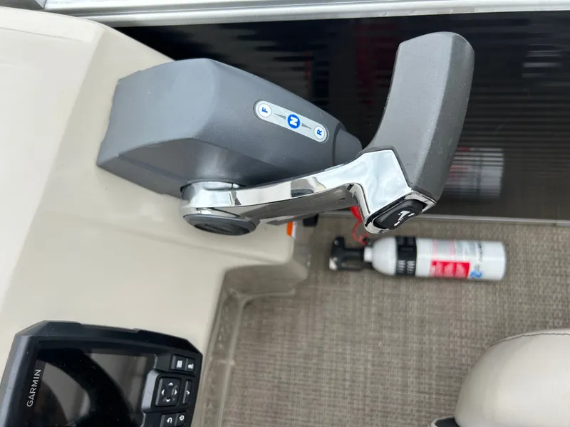 Slide: The Image of Close-up of a boat throttle lever with a fire extinguisher in the background. - 11