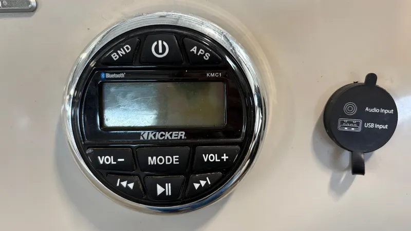 Slide: The Image of Close-up of a Kicker audio system with Bluetooth and USB input. - 12