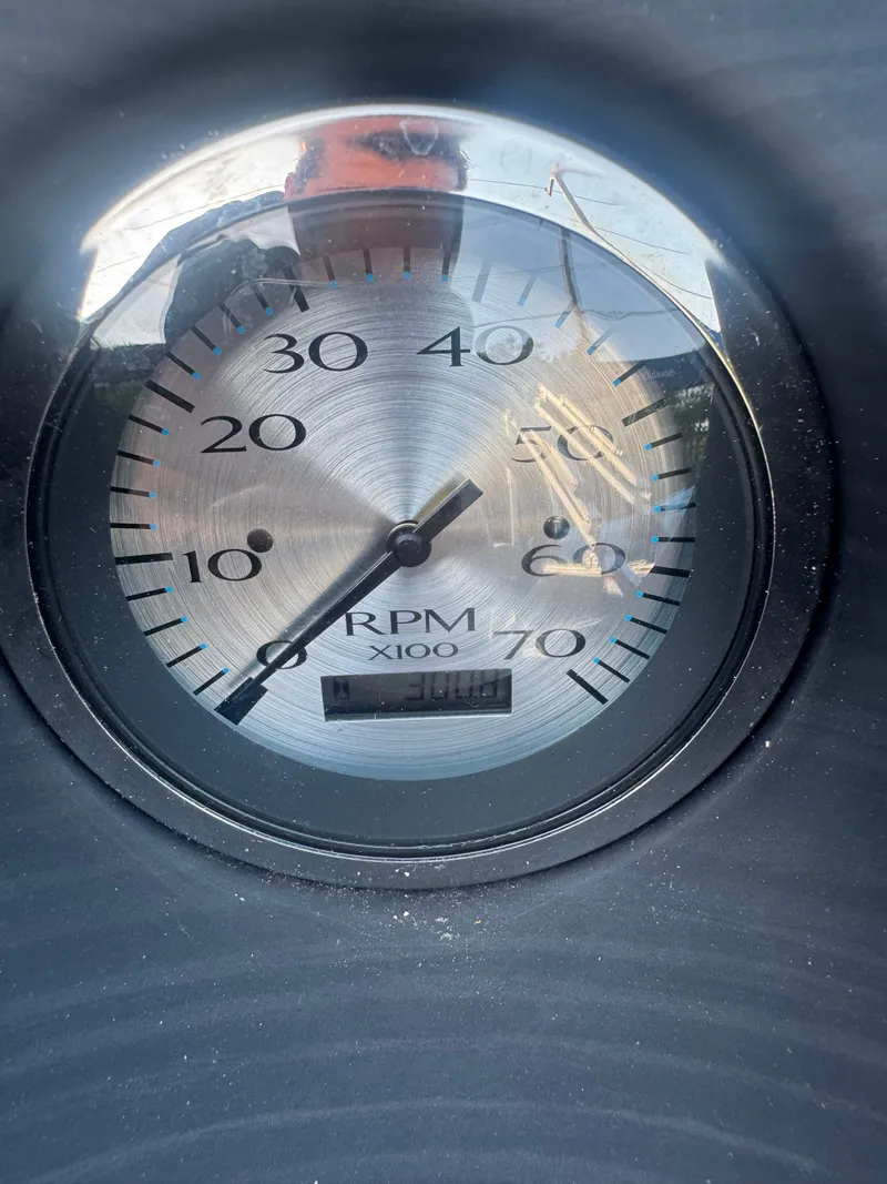 Slide: The Image of Close-up of a tachometer with a scale up to 70 RPM x100. - 10