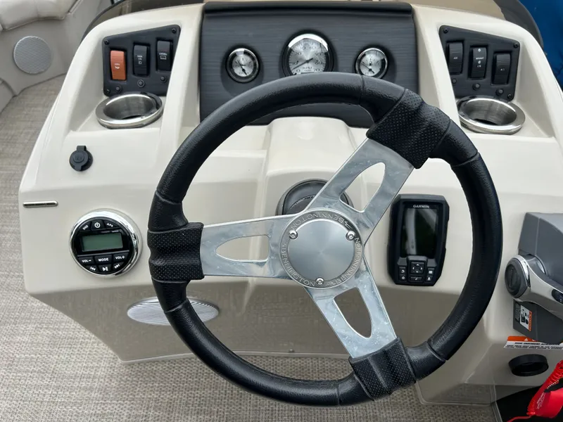 Slide: The Image of The image shows the helm of a 2019 Bennington 20SSRCX boat with instruments and controls. - 8