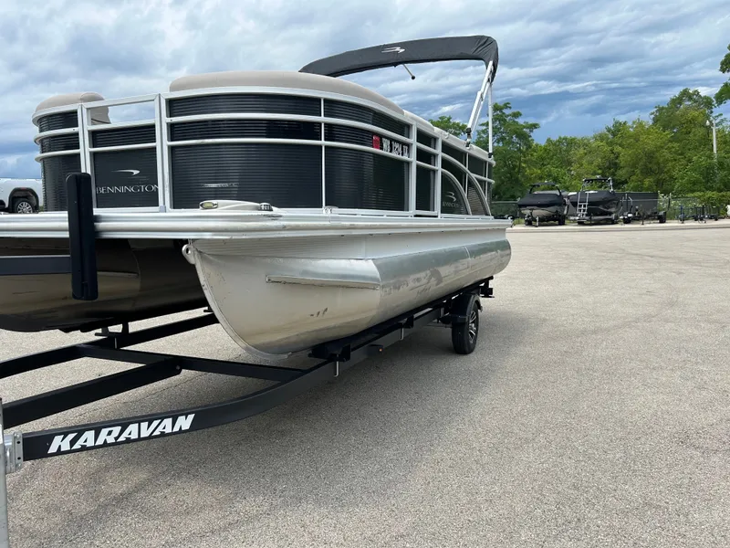 Slide: The Image of A 2019 Bennington 20SSRCX pontoon boat on a trailer, ready for transport. - 4
