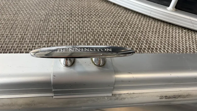 Slide: The Image of Close-up of a Bennington boat detail with a silver fitting on a textured deck. - 23