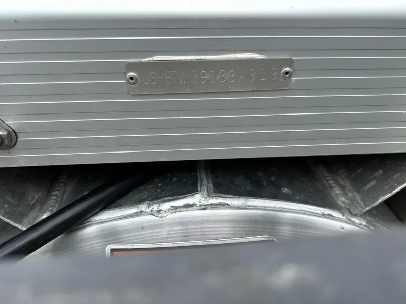 Slide: The Image of Close-up of a boat detail with a serial number. - 34