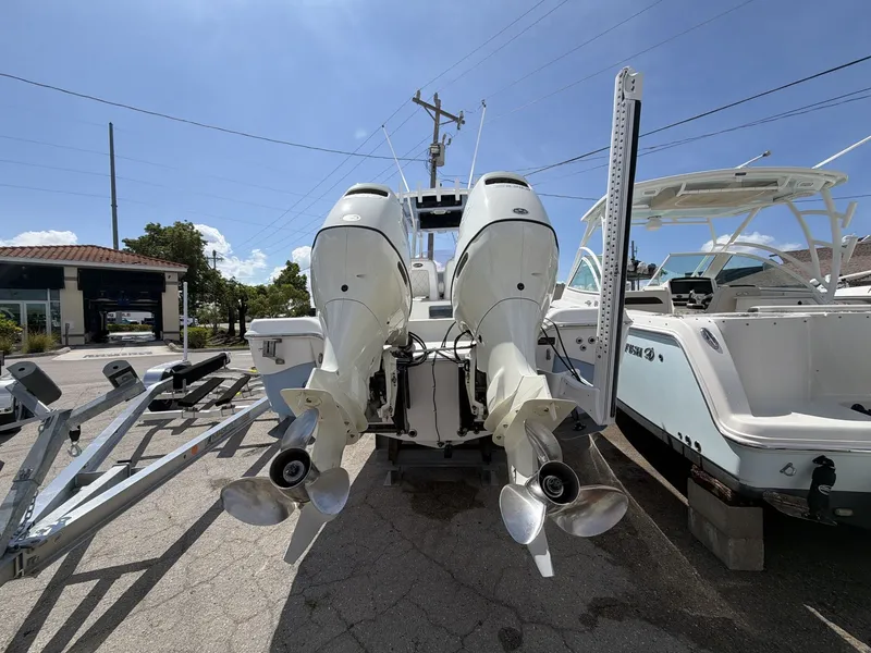 Slide: The Image of 2020 Blue Wave 2800 Makaira boat with dual outboard engines. - 25