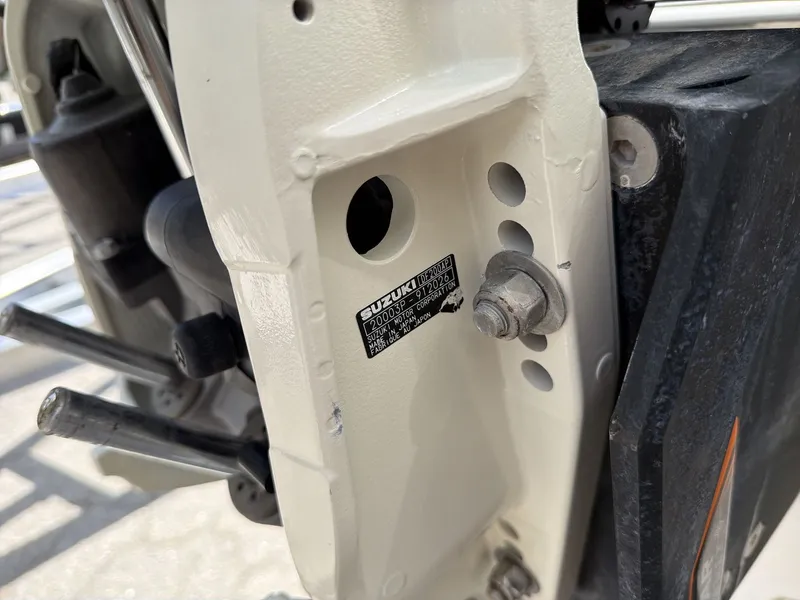 Slide: The Image of Close-up of a Suzuki engine part on a Blue Wave 2800 Makaira boat. - 29