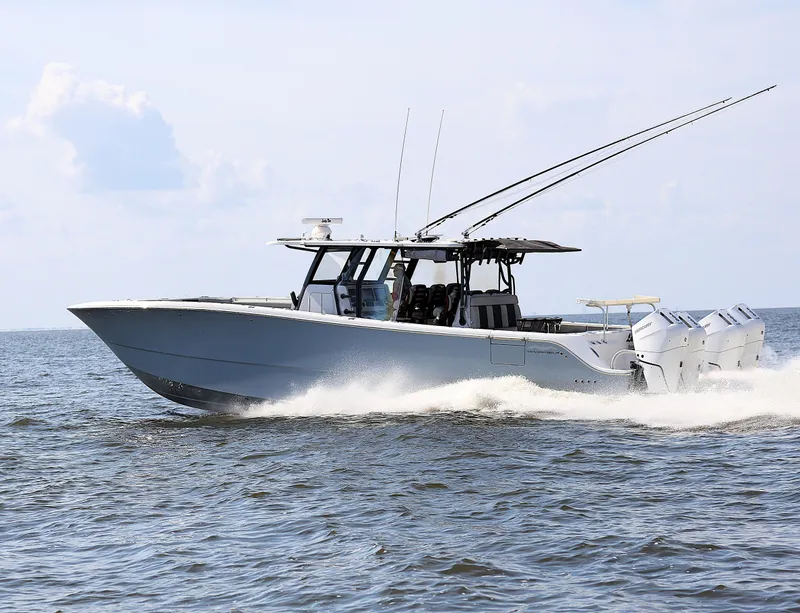 Slide: The Image of 2022 Invincible 46 Catamaran cruising on open water, showcasing sleek design and powerful engines. - 0
