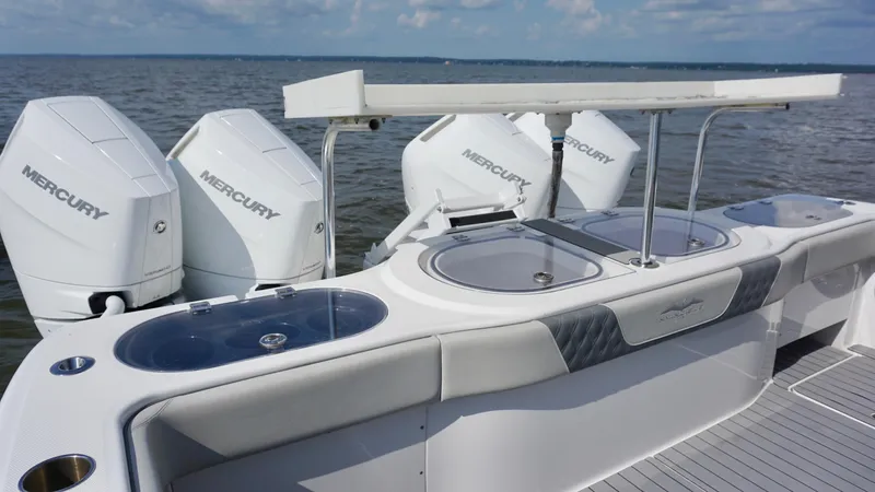 Slide: The Image of 2022 Invincible 46 Catamaran with Mercury engines, featuring a sleek fishing station. - 31