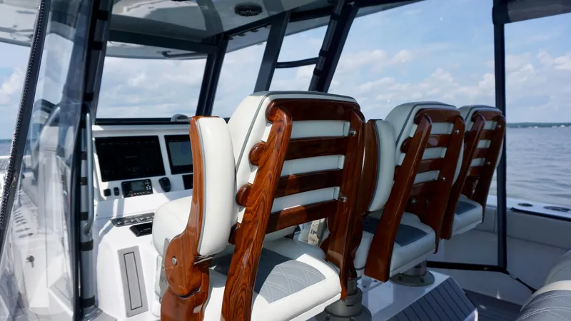 Slide: The Image of Luxurious interior of 2022 Invincible 46 Catamaran with elegant wooden seating. - 41