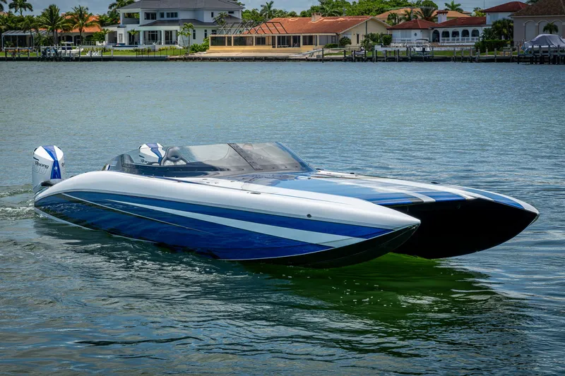 Slide: The Image of 2023 Performance Powerboats P360 on water, sleek design, blue and white color scheme. - 15