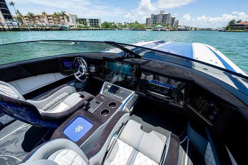 Slide: The Image of Luxurious 2023 Performance Powerboats P360 cockpit with modern controls and waterfront view. - 28