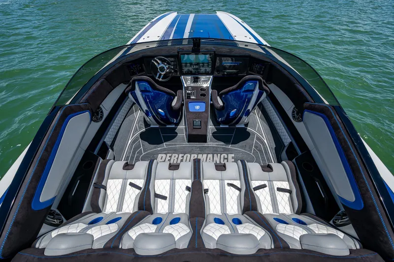 Slide: The Image of 2023 Performance Powerboats P360 interior with luxury seating and advanced controls on water. - 31