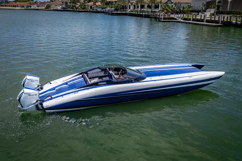 Slide: The Image of 2023 Performance Powerboats P360 on water, featuring sleek blue and white design. - 33