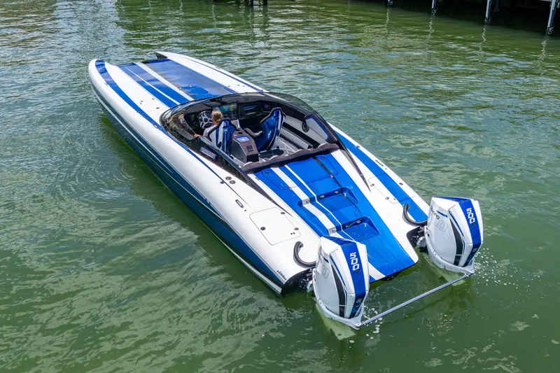 Slide: The Image of 2023 Performance Powerboats P360 on water, featuring sleek blue and white design. - 36