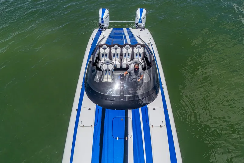 Slide: The Image of 2023 Performance Powerboats P360 on water, aerial view, blue and white design. - 41