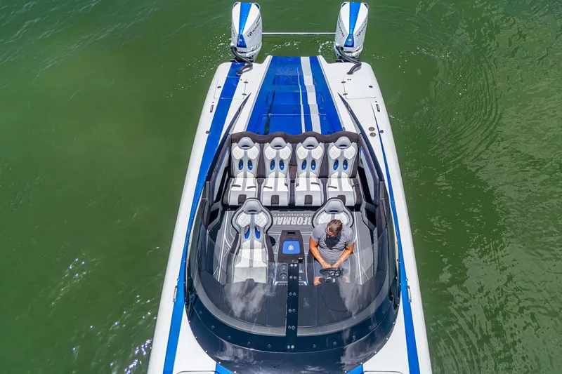 Slide: The Image of 2023 Performance Powerboats P360 on water, aerial view, featuring sleek design and dual engines. - 42