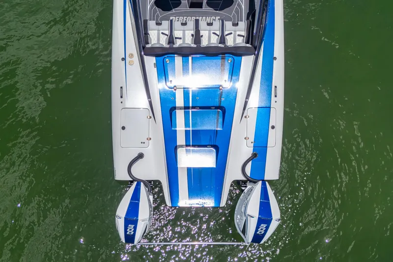 Slide: The Image of Top view of 2023 Performance Powerboats P360 with dual engines on green water. - 44