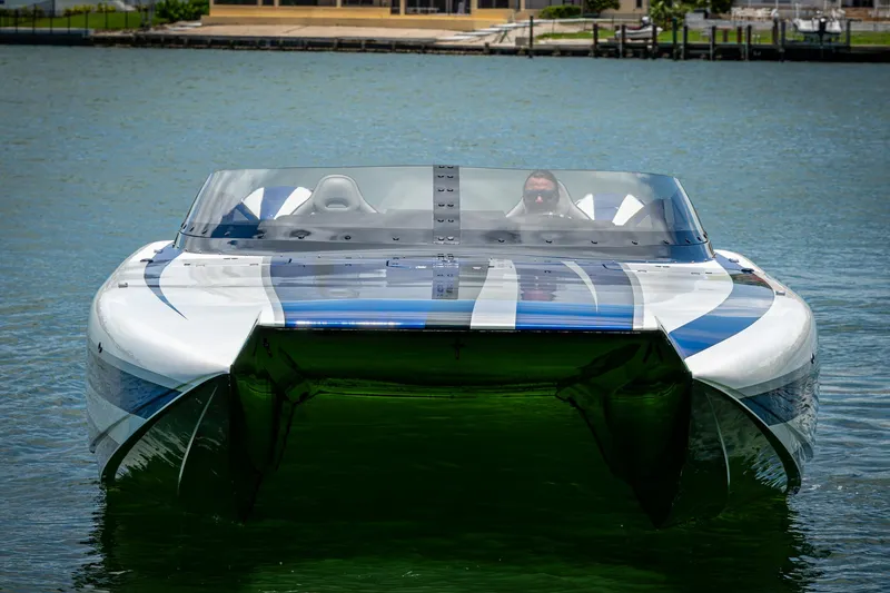 Slide: The Image of 2023 Performance Powerboats P360 on water, showcasing sleek design and vibrant graphics. - 6