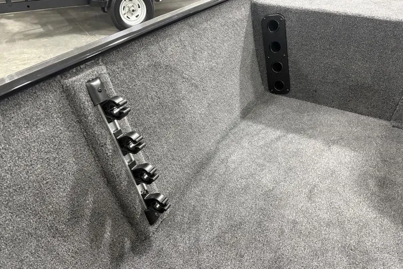 Slide: The Image of 2025 Tracker BASS TRACKER® Classic XL interior with rod holders and carpeted finish. - 13