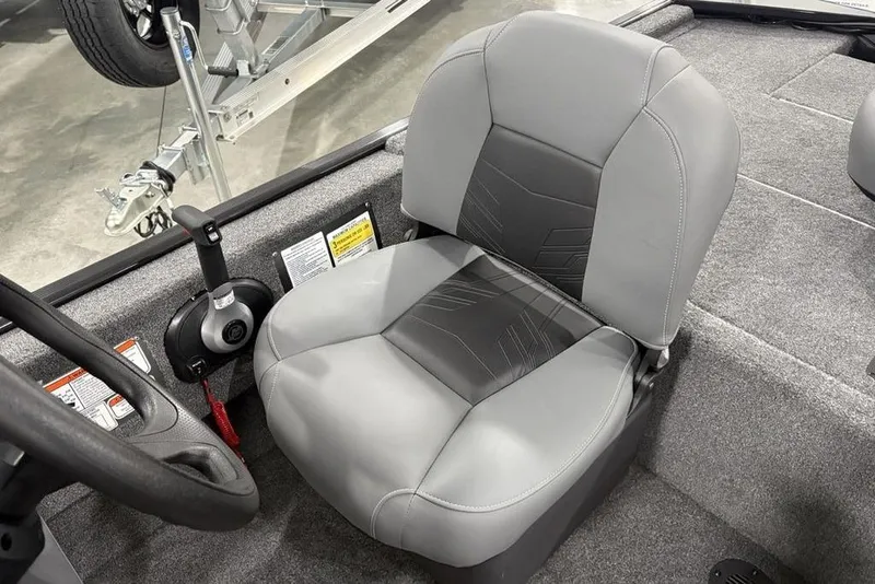 Slide: The Image of 2025 Tracker BASS TRACKER® Classic XL boat seat with steering wheel and control panel. - 18