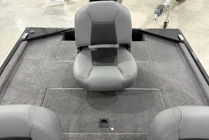 Slide: The Image of 2025 Tracker BASS TRACKER® Classic XL boat interior with gray seating and carpeted deck. - 19