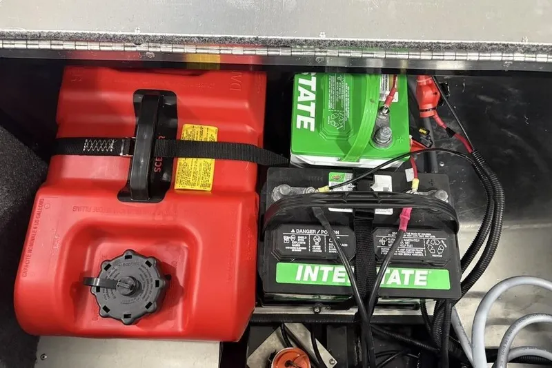 Slide: The Image of 2025 Tracker BASS TRACKER® Classic XL battery and fuel tank compartment. - 23