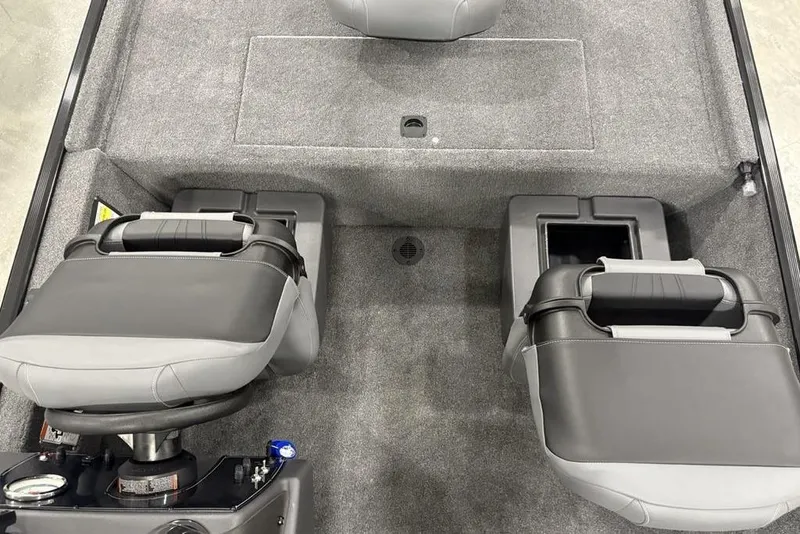 Slide: The Image of 2025 Tracker BASS TRACKER® Classic XL boat interior with gray seating and storage compartments. - 25