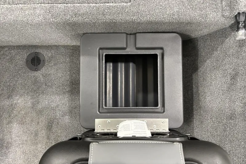 Slide: The Image of 2025 Tracker BASS TRACKER® Classic XL storage compartment with gray carpeted interior. - 26