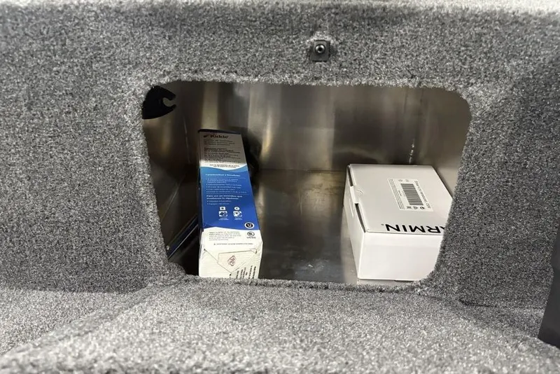 Slide: The Image of Storage compartment in 2025 Tracker BASS TRACKER® Classic XL with Garmin and Kicker boxes. - 28